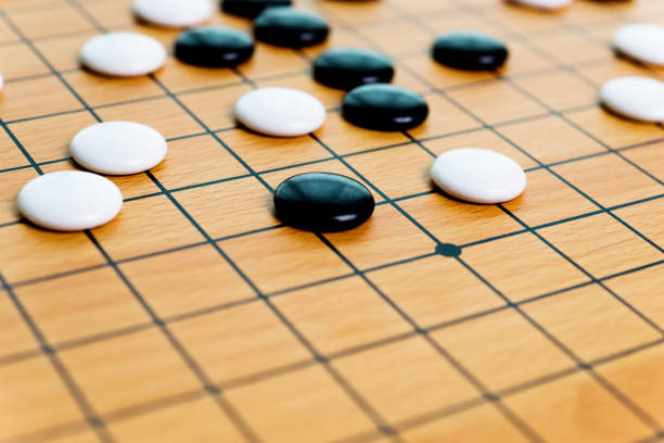 istock Go game board and pieces 1218494153