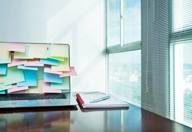 istock Laptop and note book on office desk 1218496222