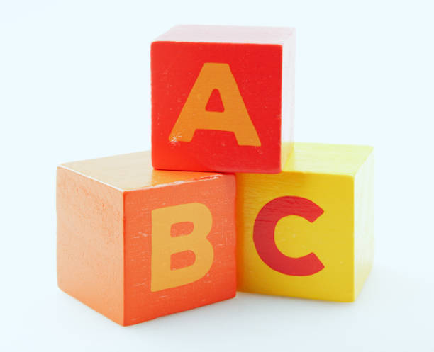 istock Wooden Alphabet Blocks Isolated On White Background 1218497352