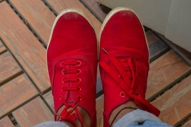 istock A pair of dirty red shoes. 1218498375