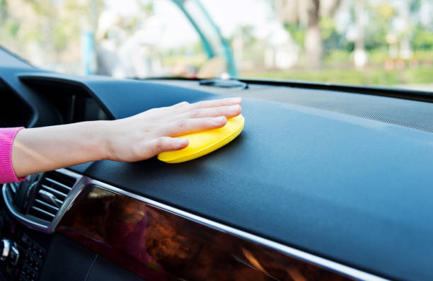 istock Woman hand cleaning car interior with cleaning sponge 1218498452