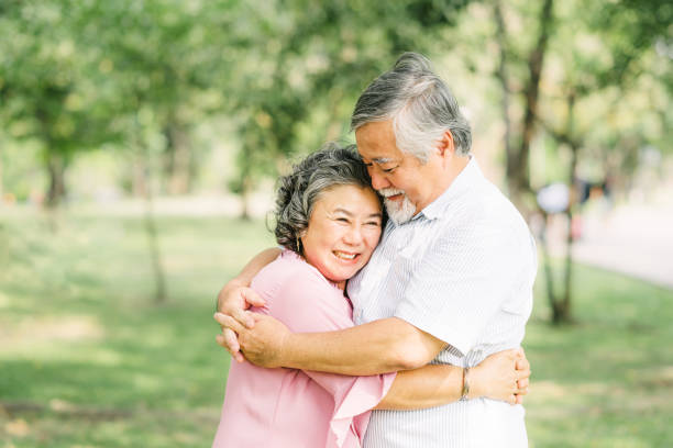 istock Happy senior Asian couple holding each other 1218501463