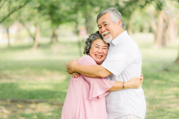 istock Happy senior Asian couple holding each other 1218501506