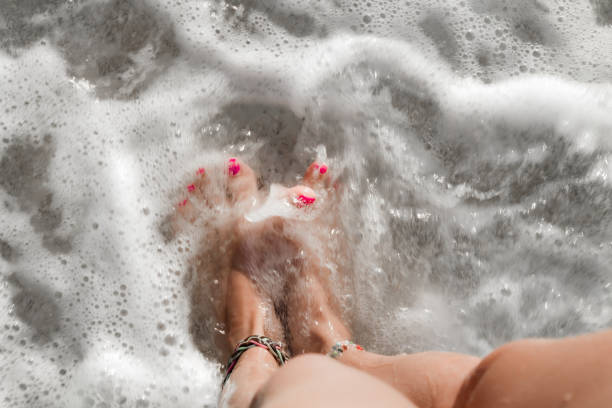istock Woman's feet on a beach, time for summertime ! 1218503200