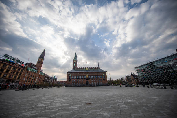 Empty Copenhagen Town Hall square during the coronavirus pandemic Easter Sunday with empty Copenhagen Town Hall square during the coronavirus pandemic. town hall square copenhagen stock pictures, royalty-free photos & images