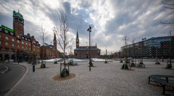 Empty Copenhagen Town Hall square during the coronavirus pandemic Easter Sunday with empty Copenhagen Town Hall square during the coronavirus pandemic. town hall square copenhagen stock pictures, royalty-free photos & images