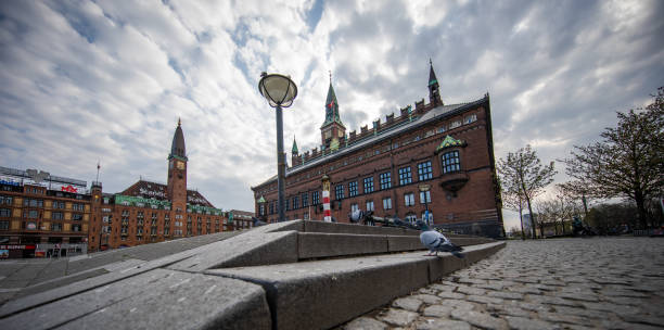 Empty Copenhagen Town Hall square during the coronavirus pandemic Easter Sunday with empty Copenhagen Town Hall square during the coronavirus pandemic.
Only the pigeons roam town hall square copenhagen stock pictures, royalty-free photos & images