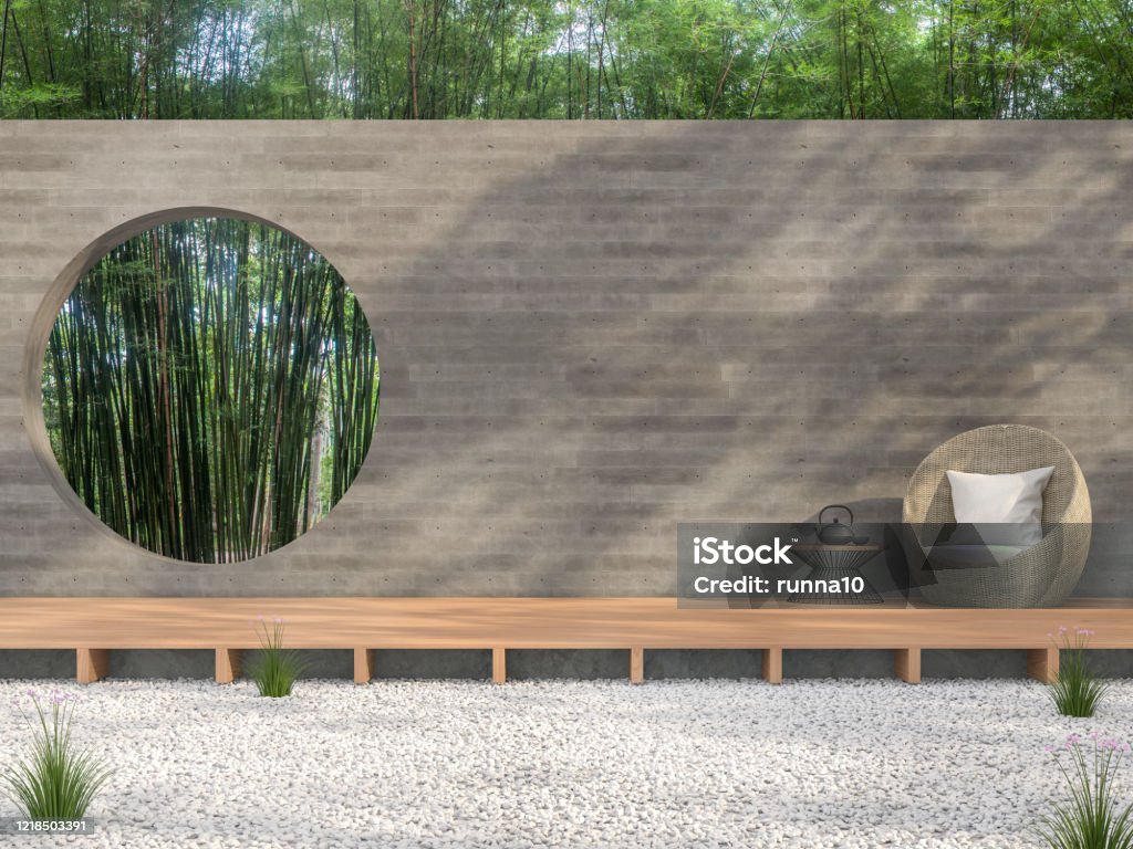Zen garden style idea 3d render Zen garden style idea 3d render,There are white stone ground,wooden terrace,blank concrete wall with circle shape of void overlooking bamboo garden background. Yard - Grounds Stock Photo