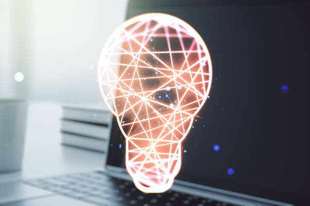 istock Creative light bulb hologram on modern laptop background, idea concept. Multiexposure 1218506387