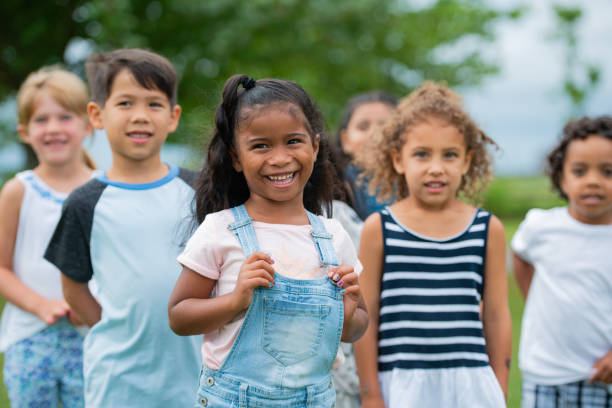istock Group of kids outside together 1218506423