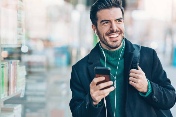 istock Happy man walking on the street 1218506477