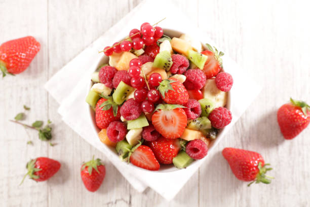 istock fresh fruit salad with berry fruit, banana, kiwi 1218507746