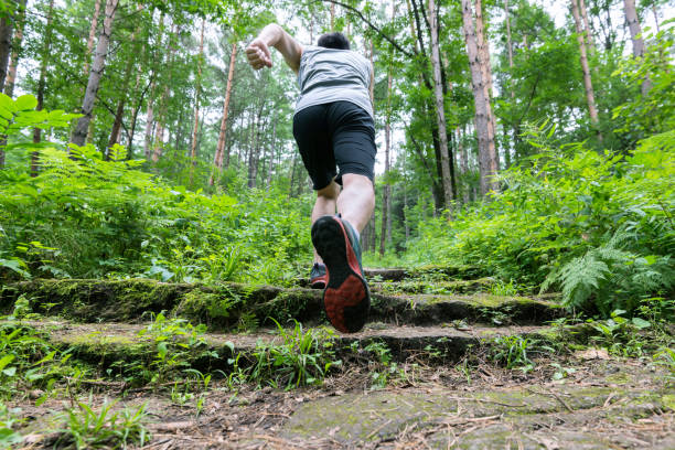 istock Man running on the steps of forest 1218508997