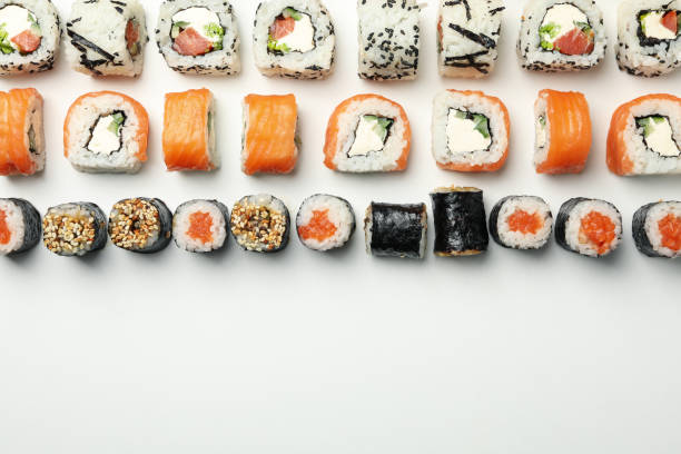 istock Flat lay with sushi rolls on white background. Japanese food 1218511162
