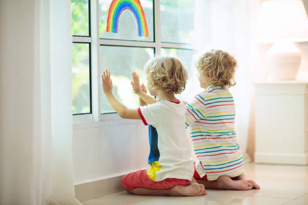 istock Coronavirus quarantine. Kids at window. Stay home. 1218511912