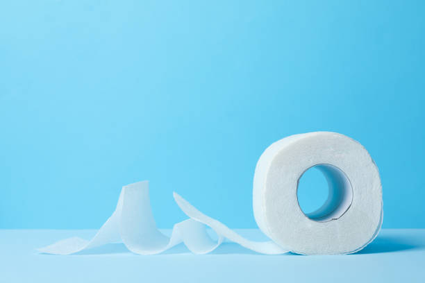 istock Toilet paper on blue background, space for text 1218512254