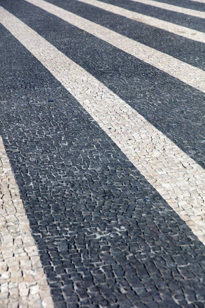 istock Closeup surface of blocky pattern old stone pavement 1218514112