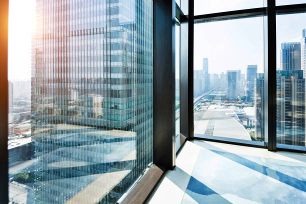 modern building and cityscape outside the window - sunny apartment window sky imagens e fotografias de stock