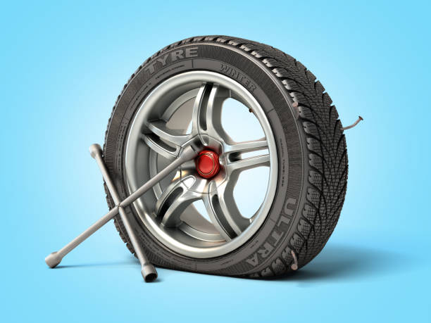 istock tire fitting concept a wheel punched with a nail and a balloon key next to it 3d render on blue gradient 1218515132
