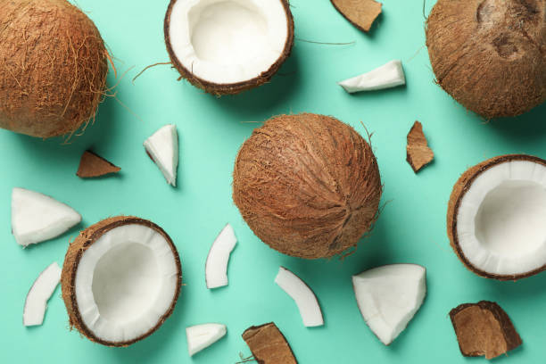 istock Flat lay with coconut on mint background, top view 1218515194