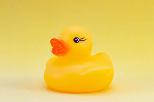 istock duck on a yellow background minimally creative concept. bathing babies 1218515896