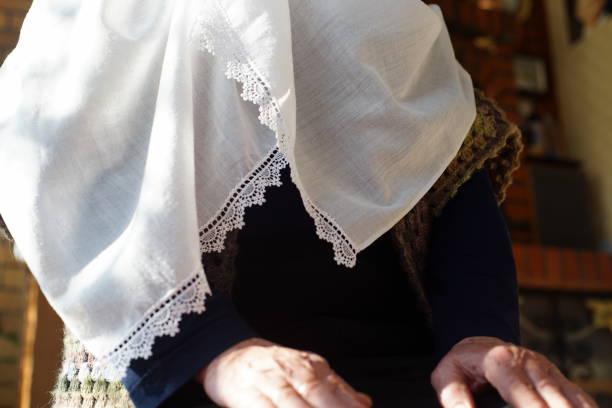 close-up of old bwhite table cloth with fine stitched pattern