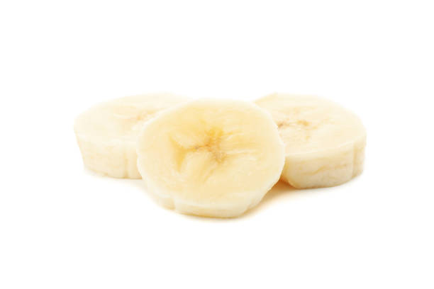istock Banana slices isolated on white background. Fresh fruit 1218516434