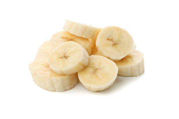 istock Banana slices isolated on white background. Fresh fruit 1218516689