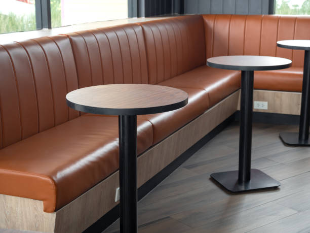 istock Leather chairs retro style on wood floor in cafe. 1218516725