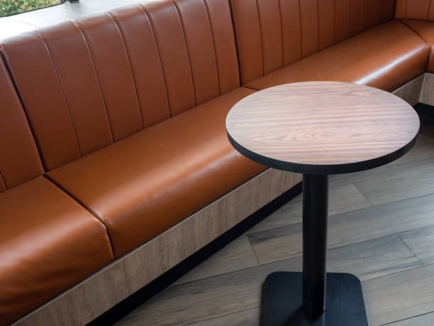 istock Leather chairs retro style on wood floor in cafe. 1218516732