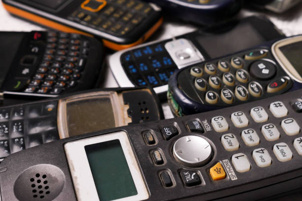 istock Many obsoleted cellphones on a grunge background. 1218518120