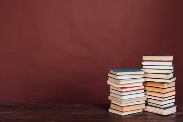 istock many stacks of educational books to study in the university library on a brown background 1218518731