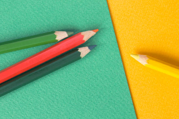 istock Pencils on colorful paper background 1218520277