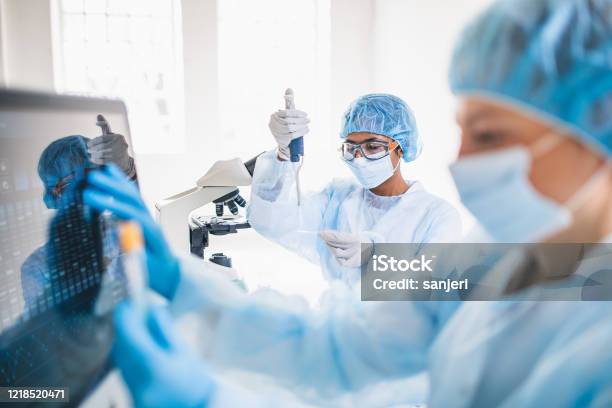 Scientists Wearing Full Protective Suit Working In The Laboratory Stock Photo - Download Image Now