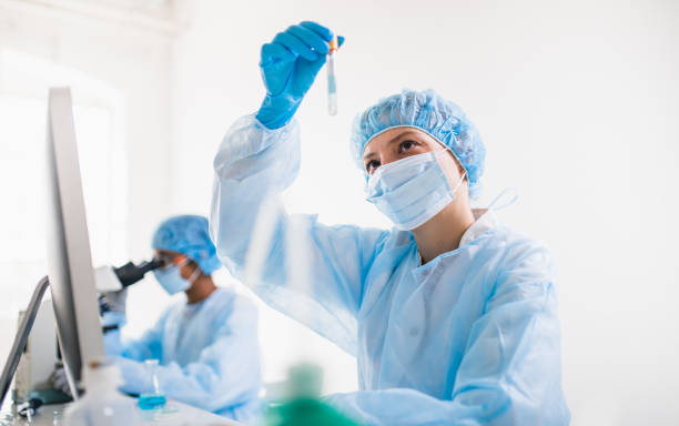 istock Scientists wearing full protective suit working in the laboratory 1218521159