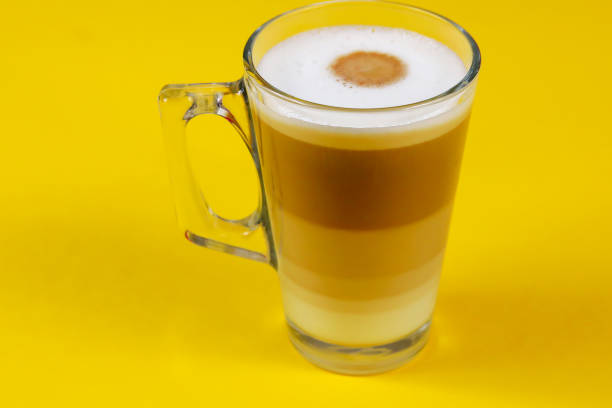 istock cup of cappuccino on a yellow background 1218521212