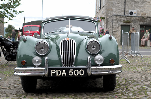 Erquy, Bretagne, France - June 25, 2022 - a Renault 4 from 1966 in a parking lot. The Renault 4 - short R4 - is a French small car of Renault and was produced from summer 1961 to end of 1992.