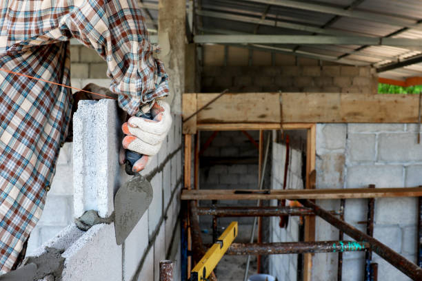 istock The hands of professional construction assistants lay bricks at the construction site. Labor concept. 1218521809