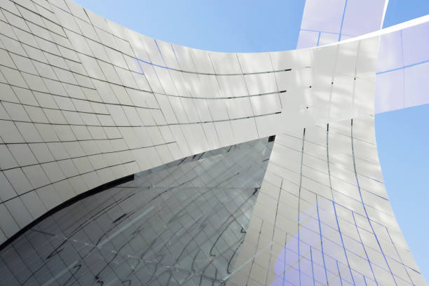 istock Semitransparent wall panels reflecting blue sky. Digitally rendered abstract glass background on the subject of modern architecture, construction industry or technology. 1218522717