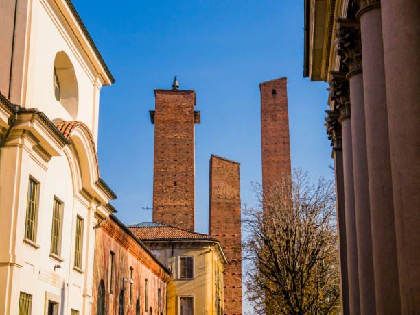 Medieval brick towers in front of the university building, Pavia, Lombardy region, northern Italy stock photo
