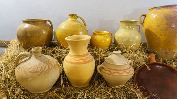 istock Rustic handmade ceramic clay yellow terracotta pots. Rural life concept. 1218527112