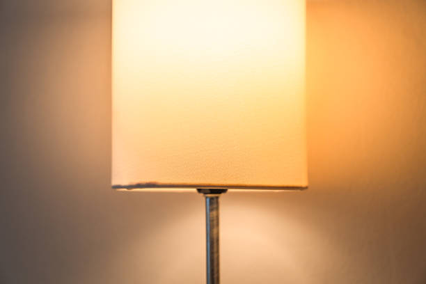 istock Lamp orange light in room at night 1218527498
