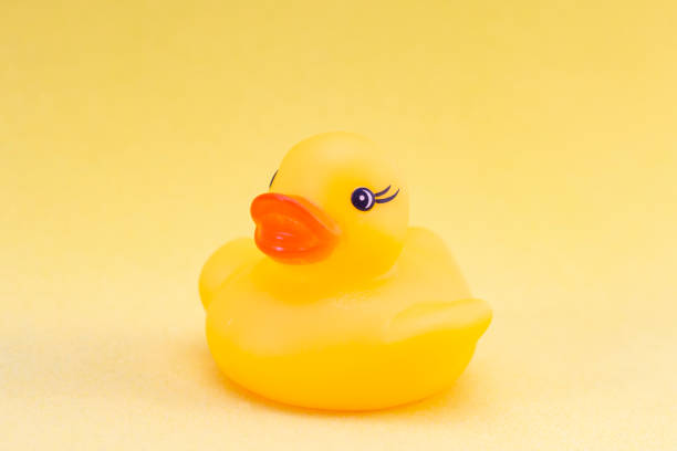istock Rubber duck on a yellow background minimally creative concept. bathing babies 1218527704