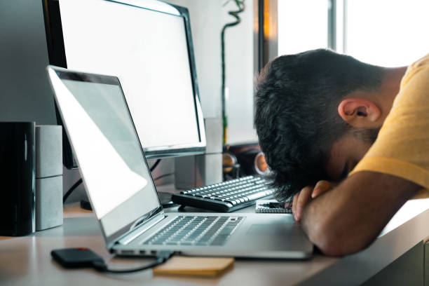 istock Tired of working from home at your desk with computers 1218527718