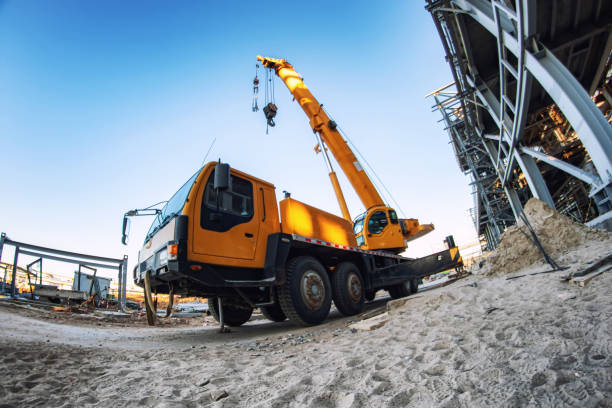 istock A large yellow truck crane stands ready to work on the construction site 1218528838