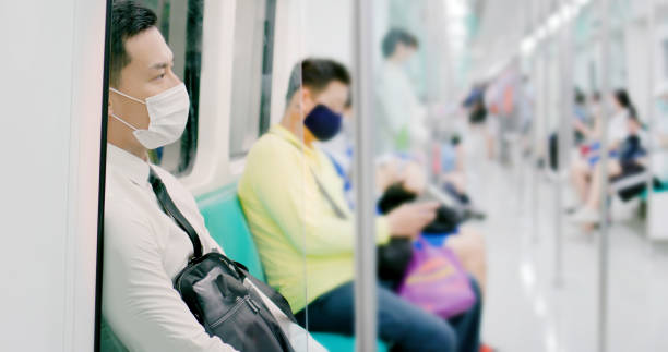 istock man with mask in metro 1218529026