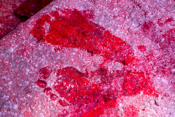Wet footprint of male feet on concrete flooring surface, top view