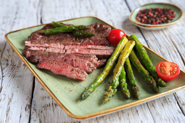 istock fresh green asparagus with steak 1218529628