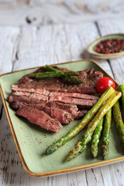 istock fresh green asparagus with steak 1218530246