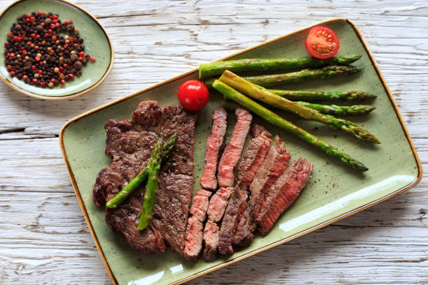 istock fresh green asparagus with steak 1218530811